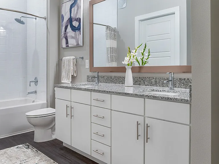 Experience luxury in this beautifully designed bathroom with chic finishes and a spacious layout.