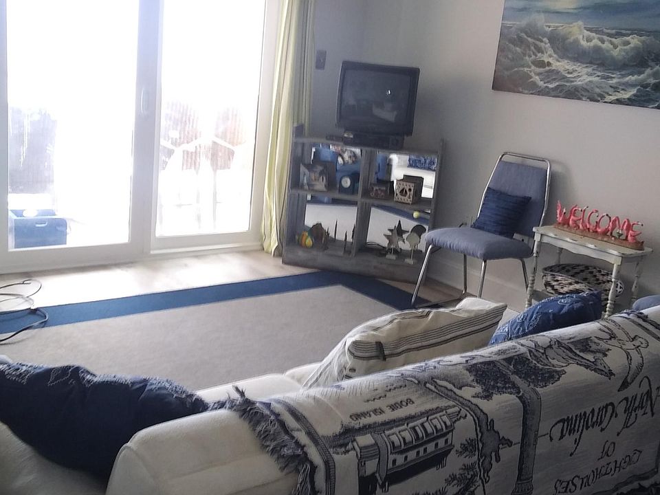 Unobstructed views to the beach are breath taking! The sofa, which makes a queen sleeper, faces the ocean and fills the condo with good vibes!