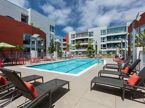 Swimming pool surrounded by lounge chairs.