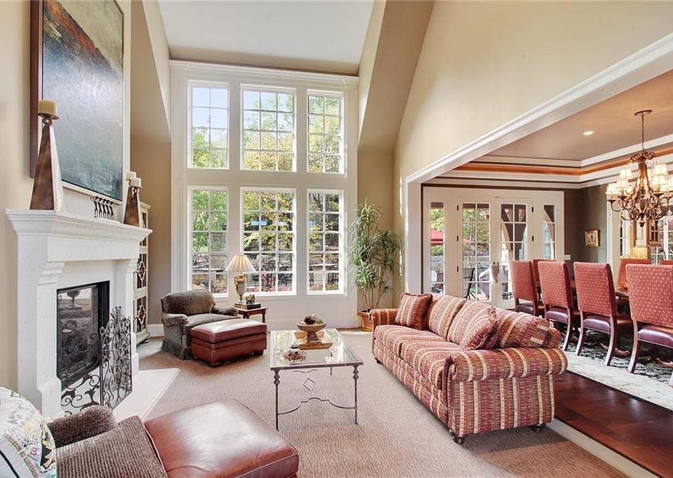 Step down to your formal living area and stunning fireplace for a cozy espresso after a wonderful meal in the dinning room...