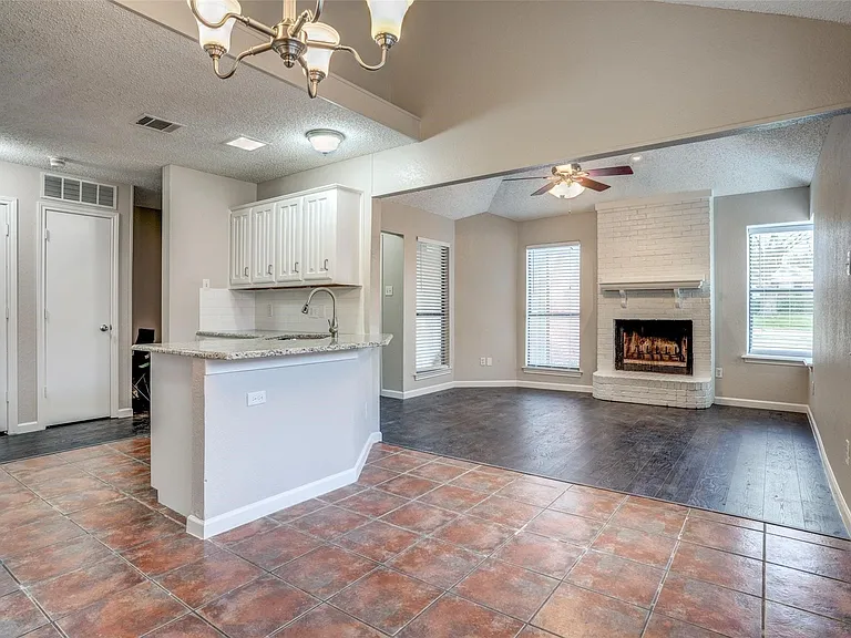 Kitchen and dining area are open to living room and has a breakfast bar.