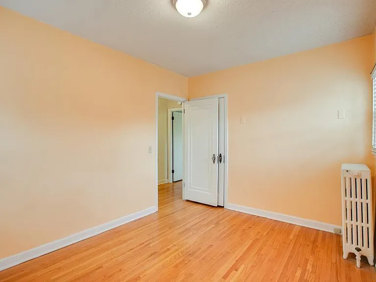 2nd Bedroom/Office (11'9" x 9'8"). Smaller closet is behind entry door. Fits 3 pc corner desk & futon (Unit 1 has Elfa (adjustable) shelving & closet rod.)