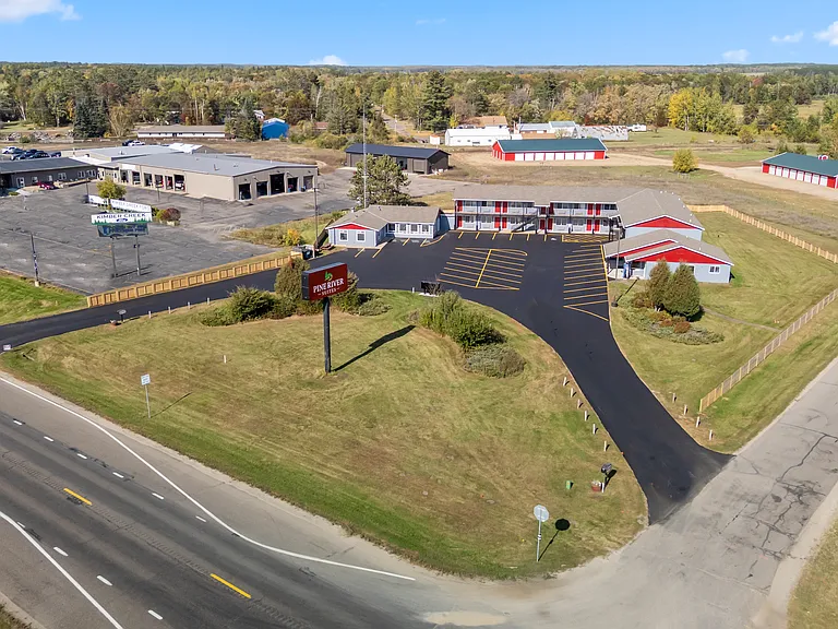 Expansive aerial view featuring easy access, generous parking, and well-maintained grounds.