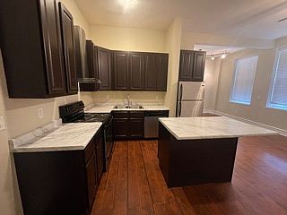 Kitchen has stainless appliances.