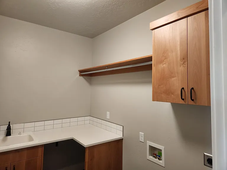 Laundry room with sink and counter