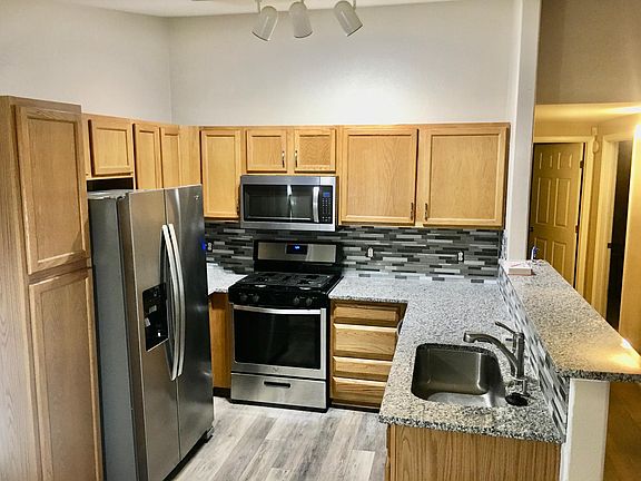 Newly remodeled Kitchen with granite and stainless steel appliances.