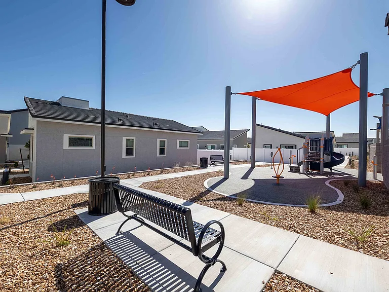 Enjoy a sunny day at the modern playground, perfect for families and relaxation.