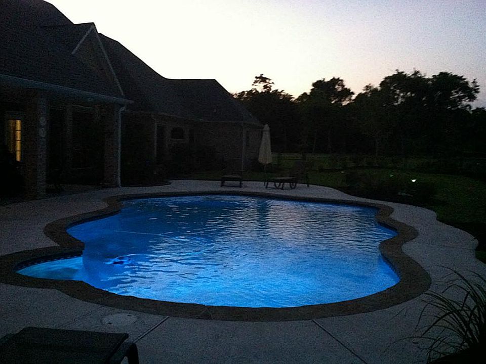 WOW! Night view of pool at sun set. Pool has programmable lights for your choice of colors.
