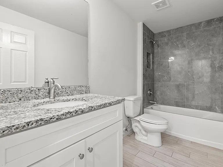 Guest bathroom, again fully tiled