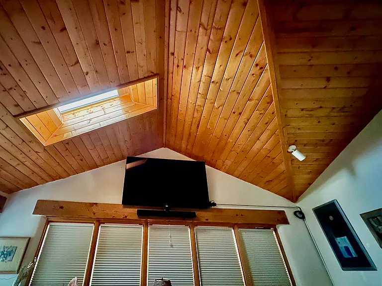 Main Bedroom view from raised bed with panoramic view and 72" TV screen.
