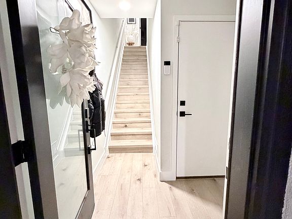 Front door entry way and door to garage