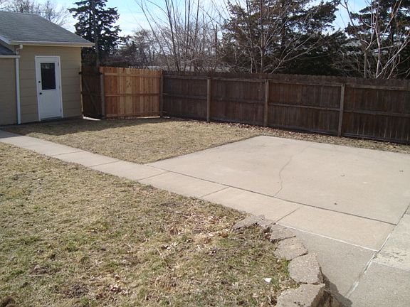 fenced  back yard with patio