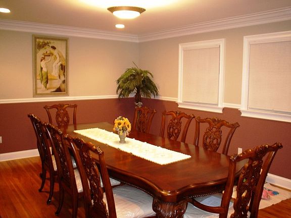 Dining room with chair rail and crown molding
