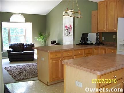 Kitchen snack bar w/ Front Room in backgrou