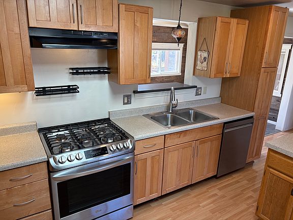 Stainless steel appliances, gas stove and dishwasher.