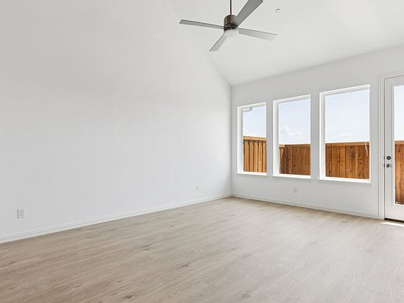 Family in the Hanna Floorplan at Midtown GP in Grand Prairie, TX.