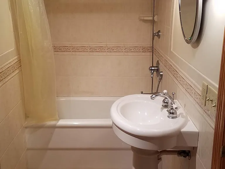 Lower level full bath, en-suite to fourth bedroom