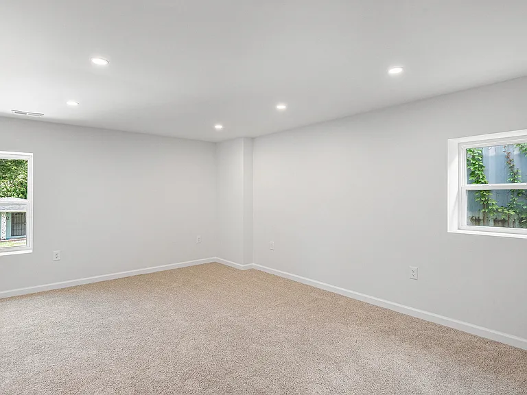 Master bedroom with walk-in closet and ensuite bathroom with walk-in shower