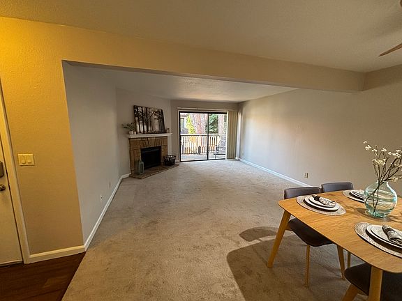 Living room with wood burning fireplace