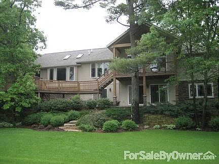 Back
						:
						Walk-out basement with an extensive deck and a secluded jacuzzi.