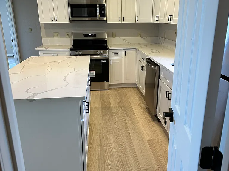 spacious kitchen island with storage and walkway