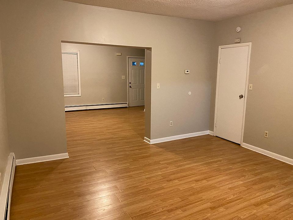Living room (background) and full dining room (foreground)