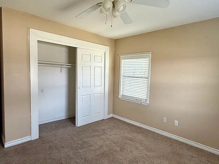 Third Bedroom:
Spacious layout, ceiling fan, ample closet space