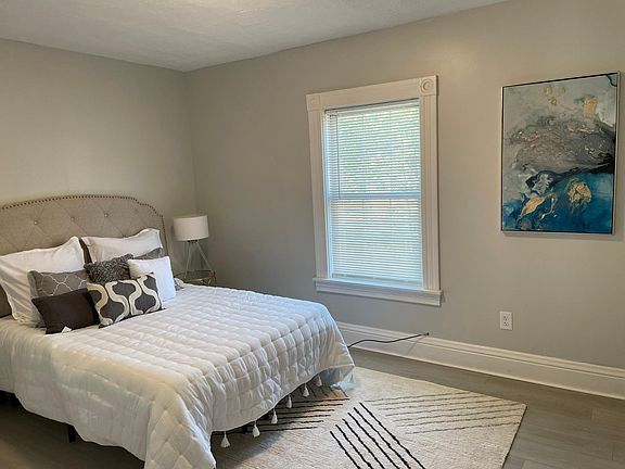 Large master bedroom with natural light.