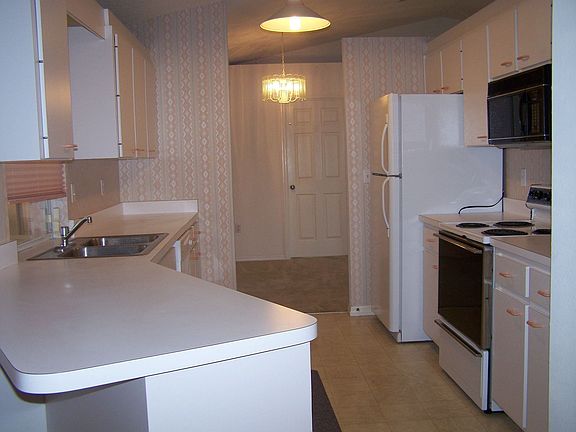 Kitchen with new dishwasher and refrigerator