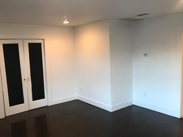 From right corner of living room. Pocket doors to study