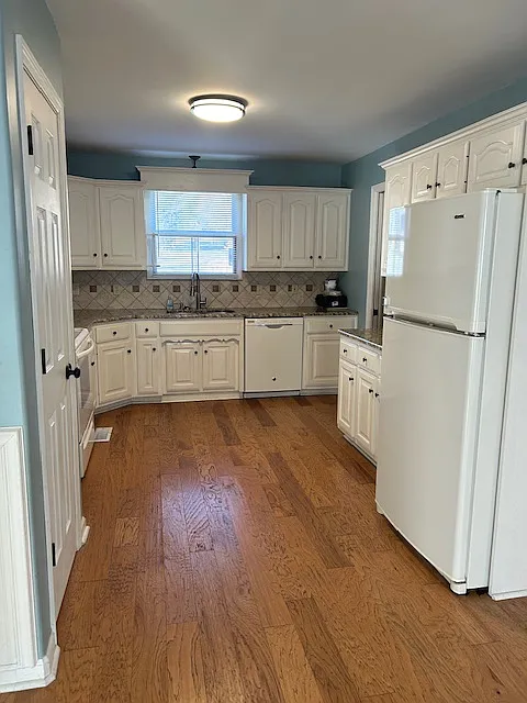 Large kitchen with granite countertops and tile backsplash. All appliances included. - 3024 Gladeville Cir