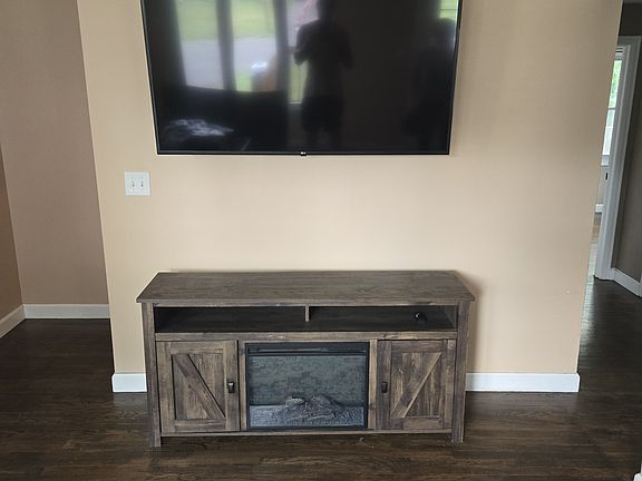 Living room- Landlord will mount tenants TV.