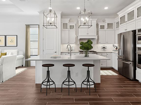 Kitchen with wood-look tile flooring and glass upper cabinets
