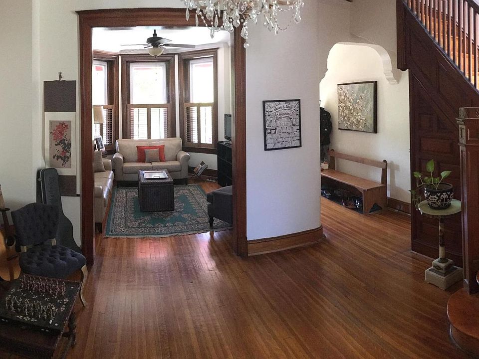 Main foyer with beautiful original hardwood staircase