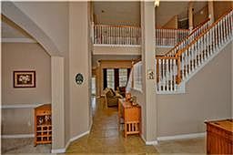 Tiled entry w/high ceilings. Dining in on the left and an open study on the right