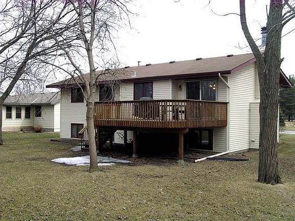 Deck overlooking wooded backyard