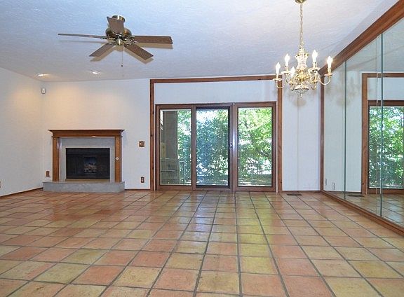 Living room has a gas log fireplace