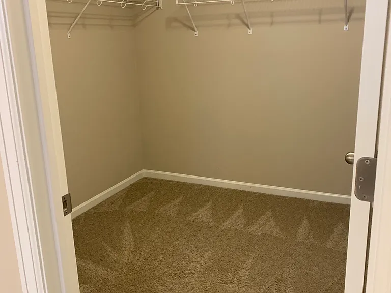 Master bedroom closet. It's a small room, and a huge closet.