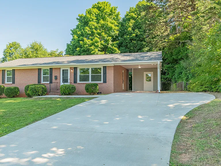Front View w/ carport and storage