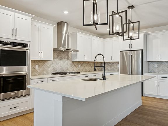 The kitchen has gorgeous quartz countertops.