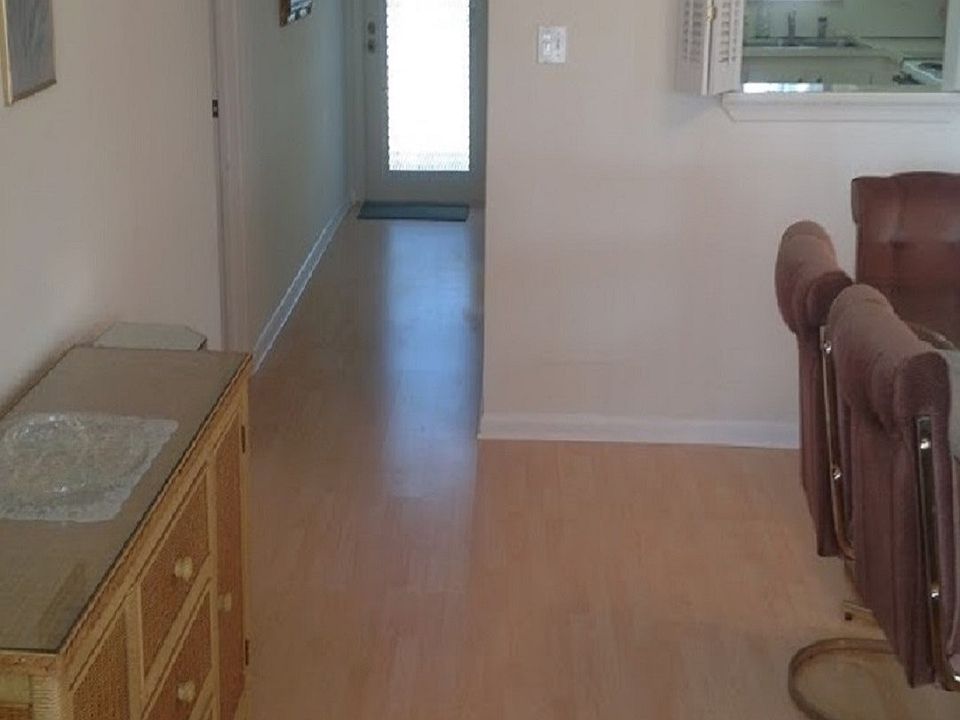 Looking back down condo from sitting room