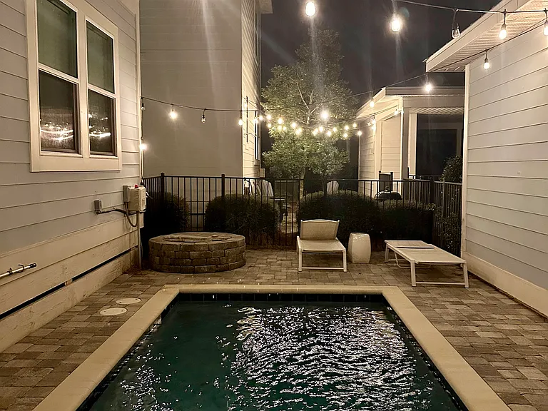Enjoy the pool day or night with cafe lighting