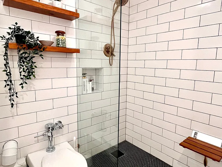 Walk in shower with fold down shower stool