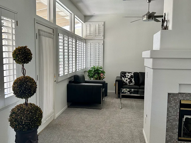 Double sided fireplace and back yard French door entry