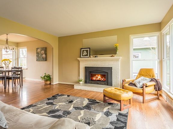 Original Mid-century details throughout out - gleaming hardwood floors and 2 cozy fireplaces.