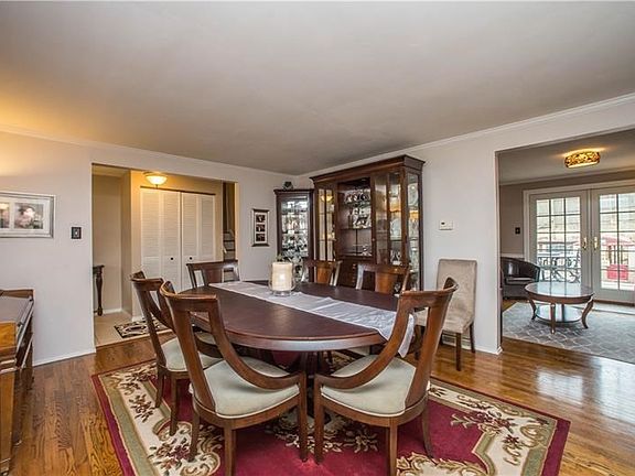 The main level dining area is perfect for entertaining large groups of friends and family. With so much additional living space 