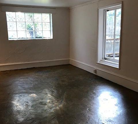 Unique window/door provides access to the screened porch.