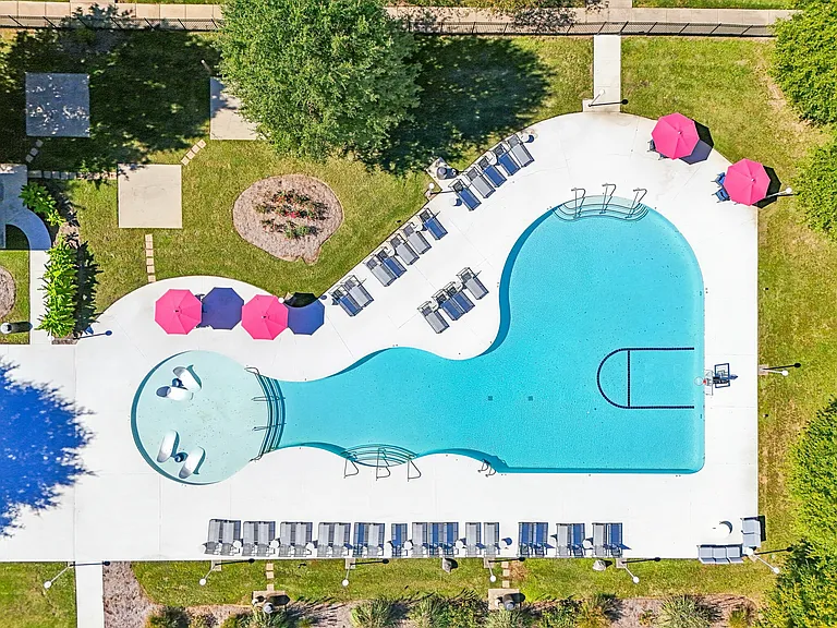 Enjoy the resort-style pool with relaxing tanning ledges, lounge chairs, and shaded seating areas at The Preserve Murfreesboro.