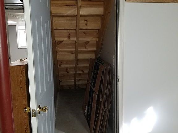 In basement under stair way.