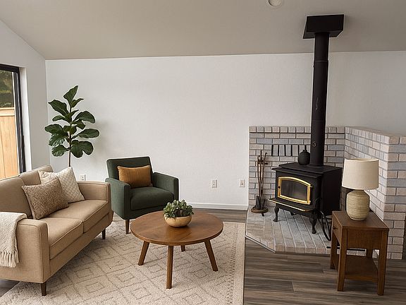 Living room with wood burning fireplace